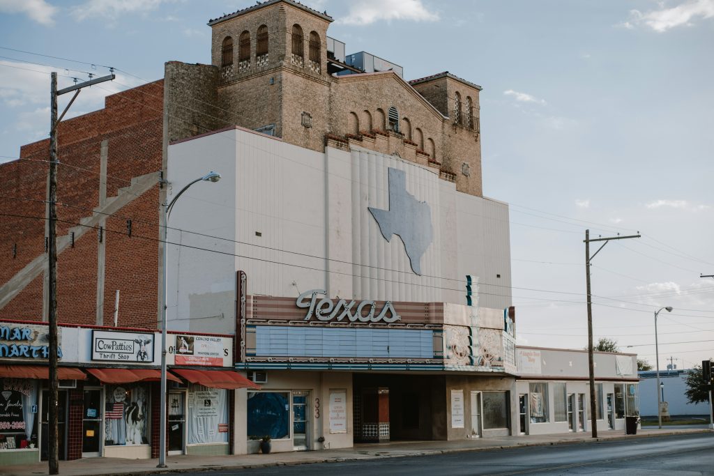 Historic church building with Texas-shaped mural.
